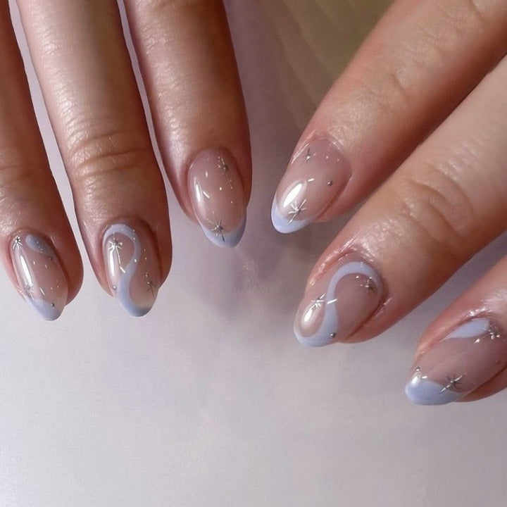 Artful nail art with elegant wave lines and glitter effects Bowlift