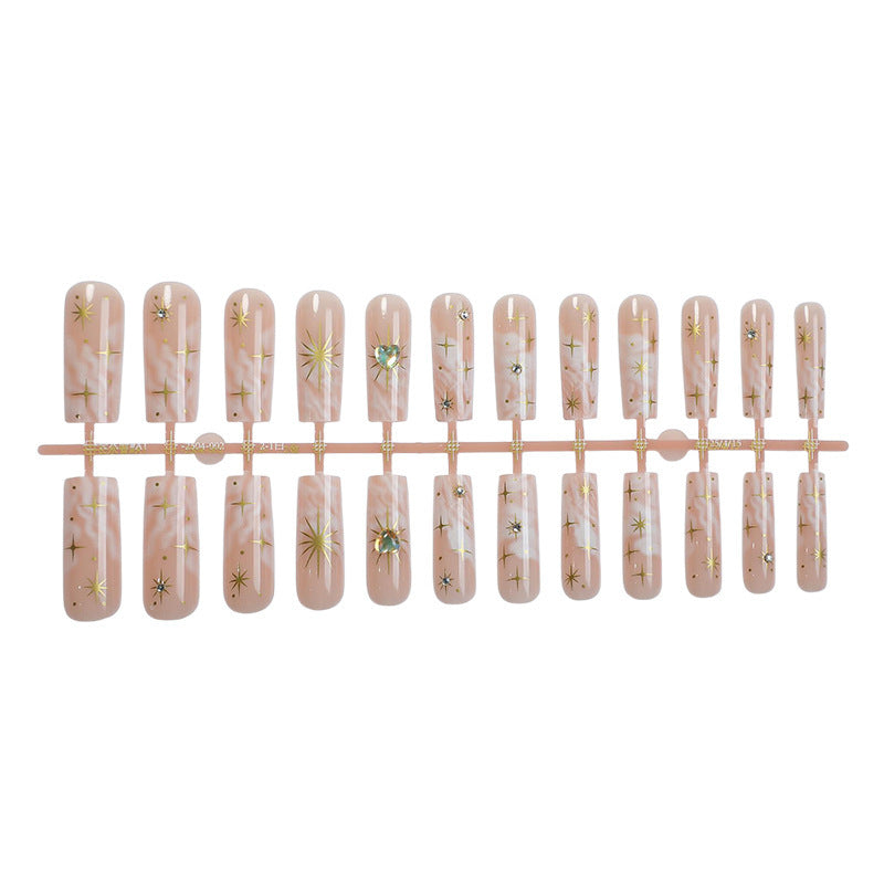 Nail set with glamorous gold decorations Bowlift