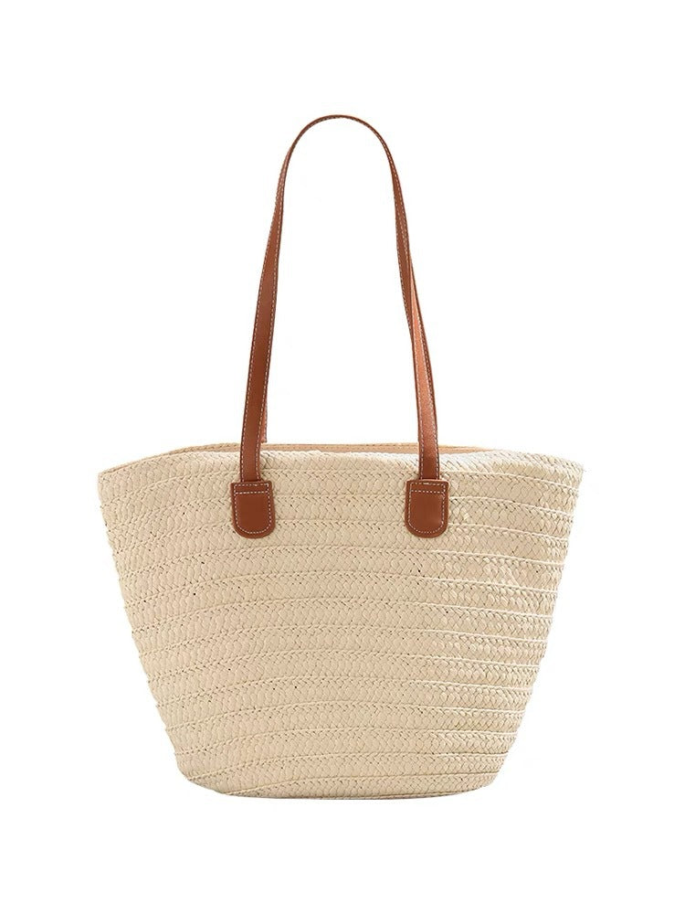 Stylish beach bag made of woven natural material with leather handles Bowlift