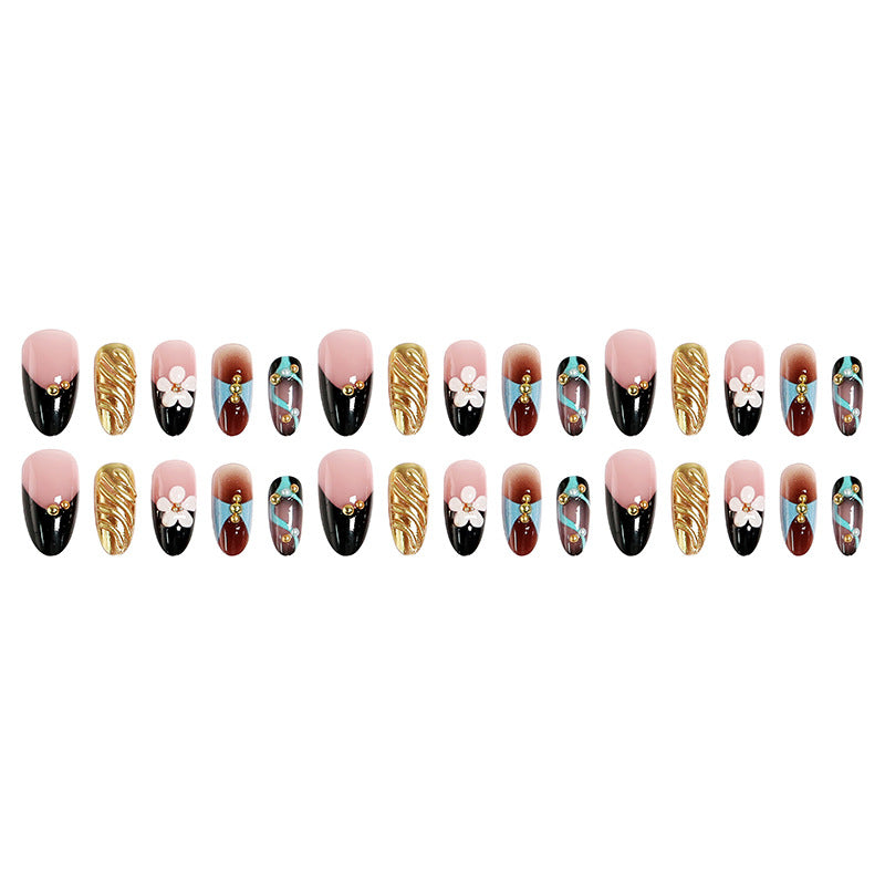 Artificial nail set with filigree floral decorations and glamorous accents Bowlift
