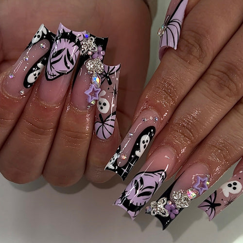 Artificail nails with creative Halloween design and glitter accents Bowlift