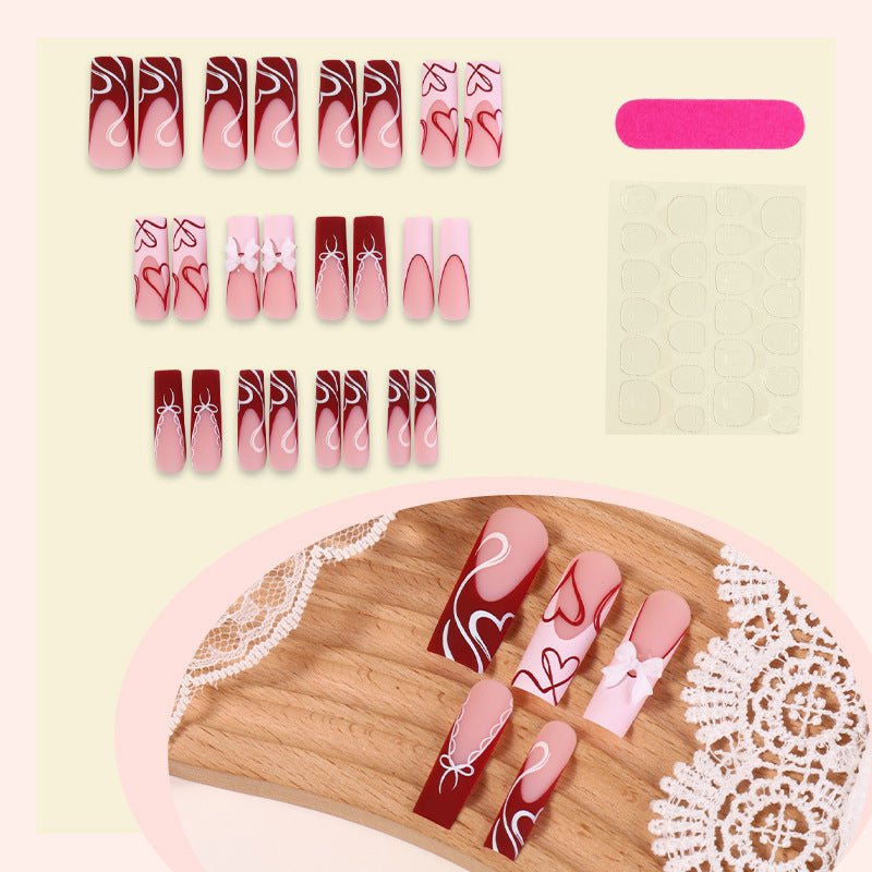artistic nail set with heart and bow motifs Bowlift