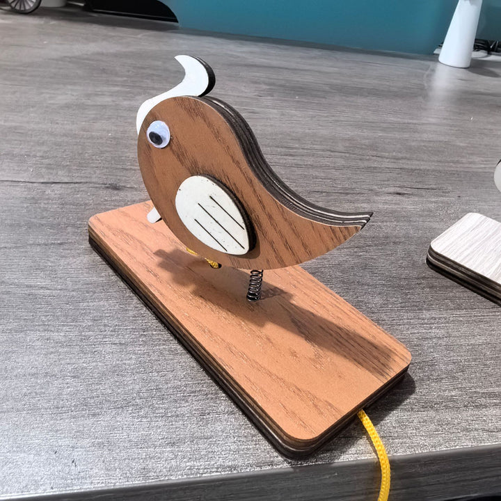 Unisex nan movable wooden bird table figure made of plywood with spiral spring and pull line Bowlift