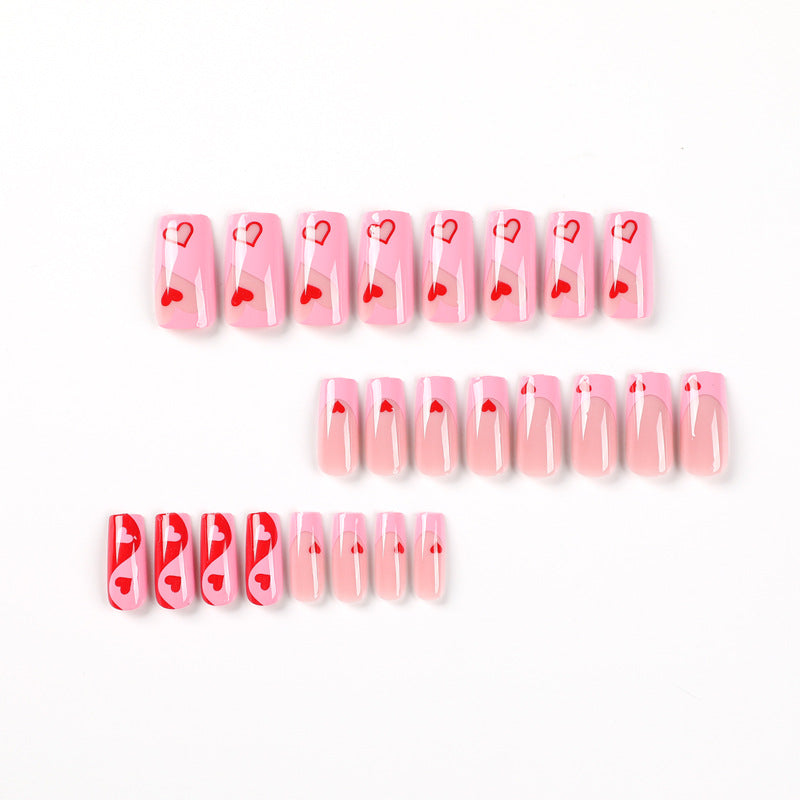Artificial nail art with heart design and glitter accents Bowlift
