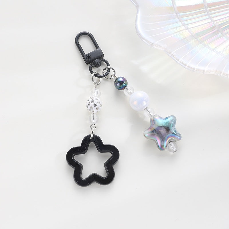 Playful keychain with floral and star motif Bowlift