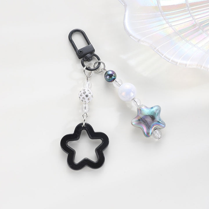 Playful keychain with floral and star motif Bowlift