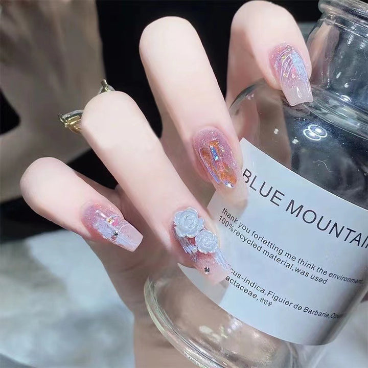 Artistic nail art with floral embellishments Bowlift