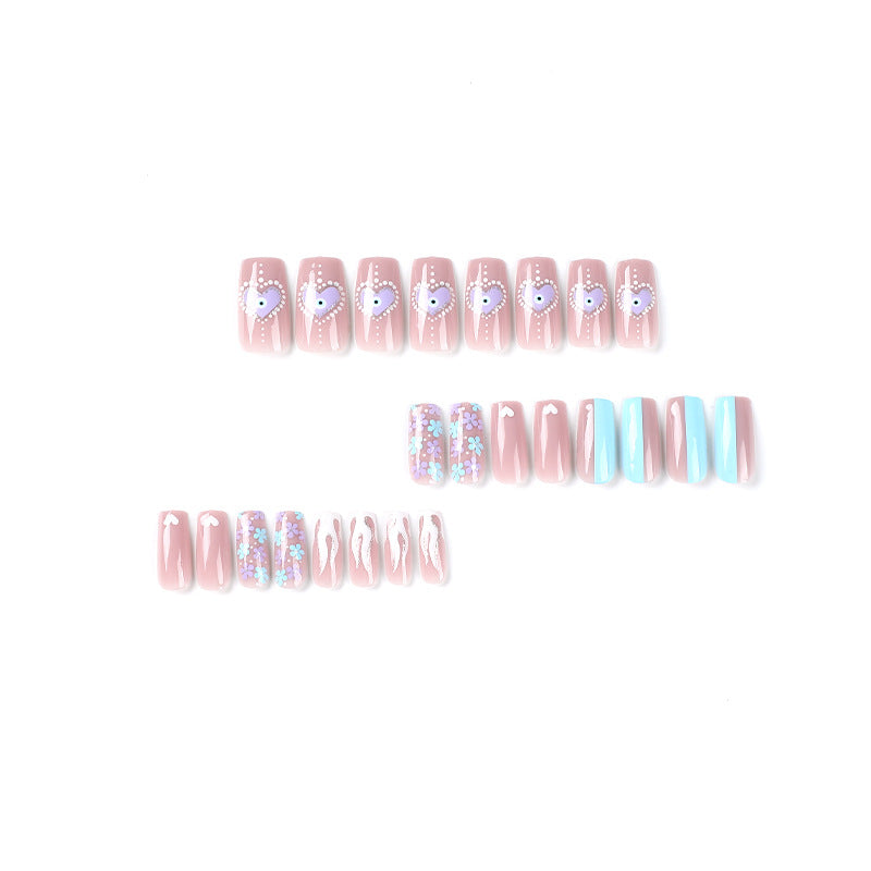 Artful nail art with floral accents and glitter embellishments Bowlift