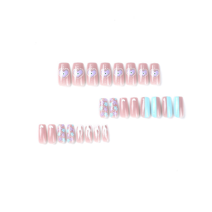 Artful nail art with floral accents and glitter embellishments Bowlift