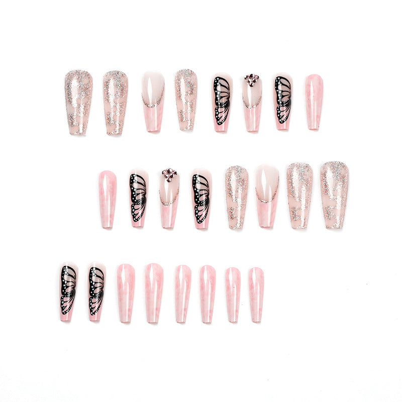 Glamorous nail extensions with beautiful butterfly motifs and glitter accents Bowlift
