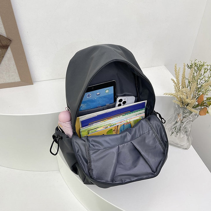 Backpack with Versatile Compartments and Charming Pendant Bowlift