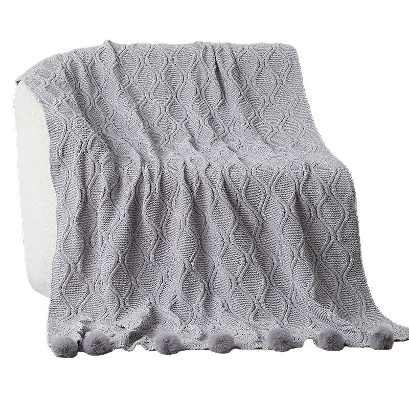 Ladies knit blanket with decorative pom poms Bowlift