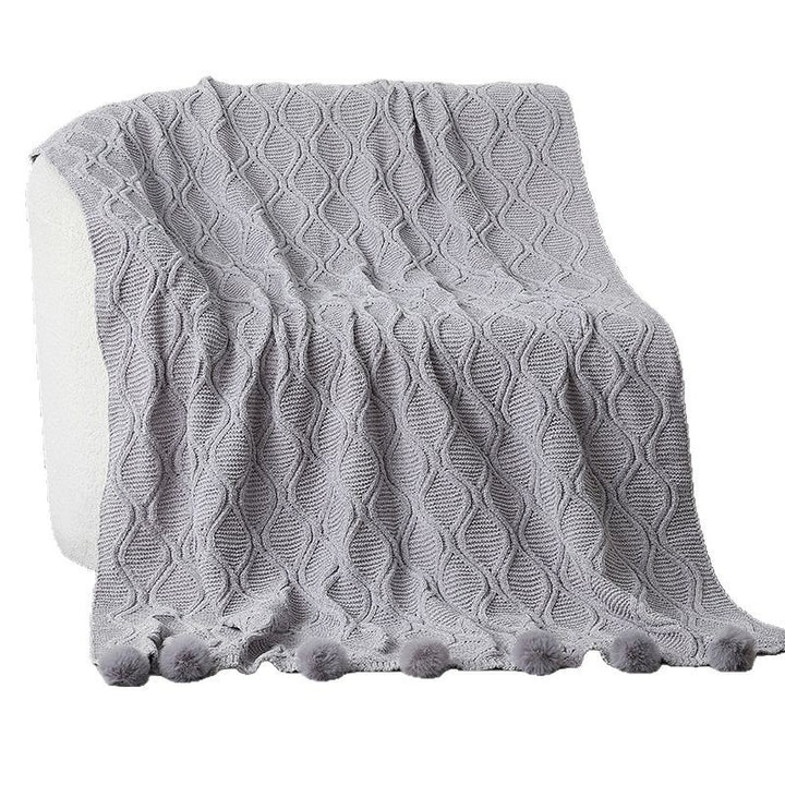 Ladies knit blanket with decorative pom poms Bowlift