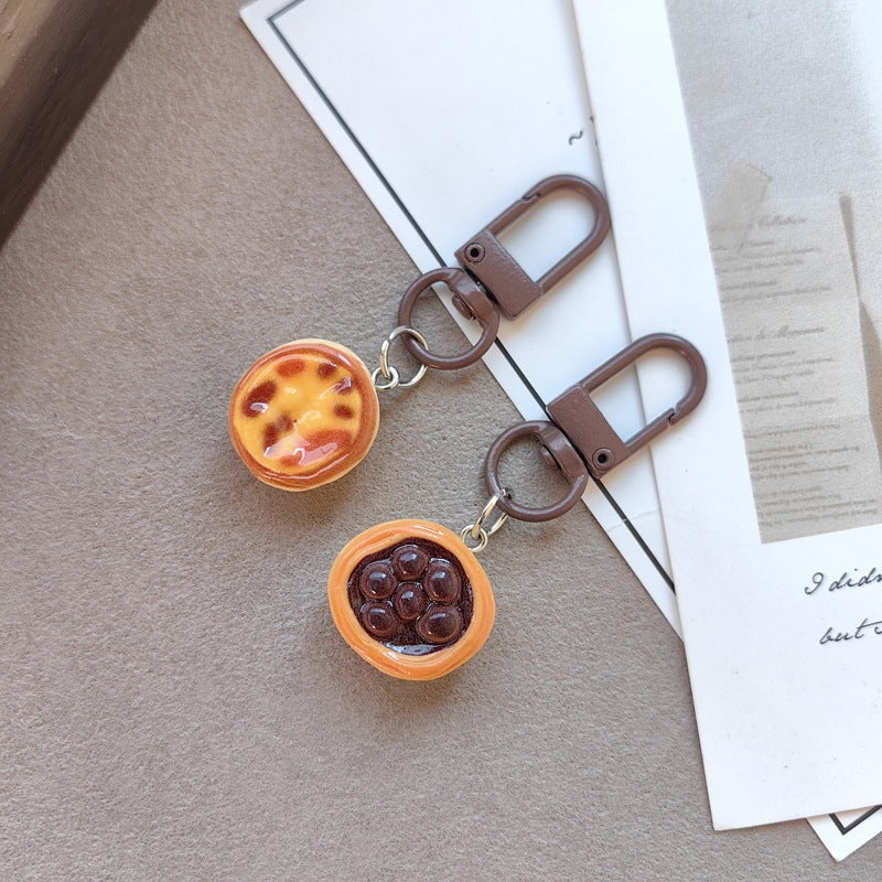 Keychain with cute cake design Bowlift
