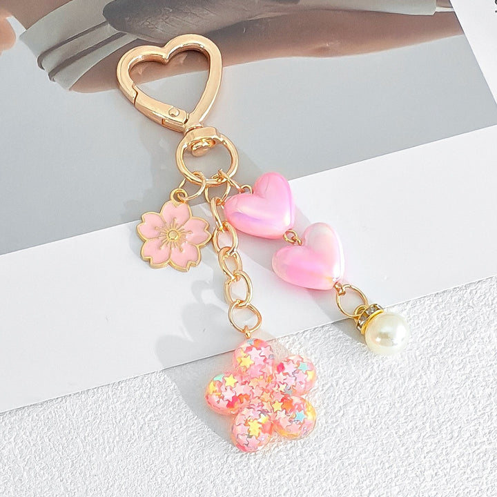 Playful keychain with hearts and flower motif Bowlift