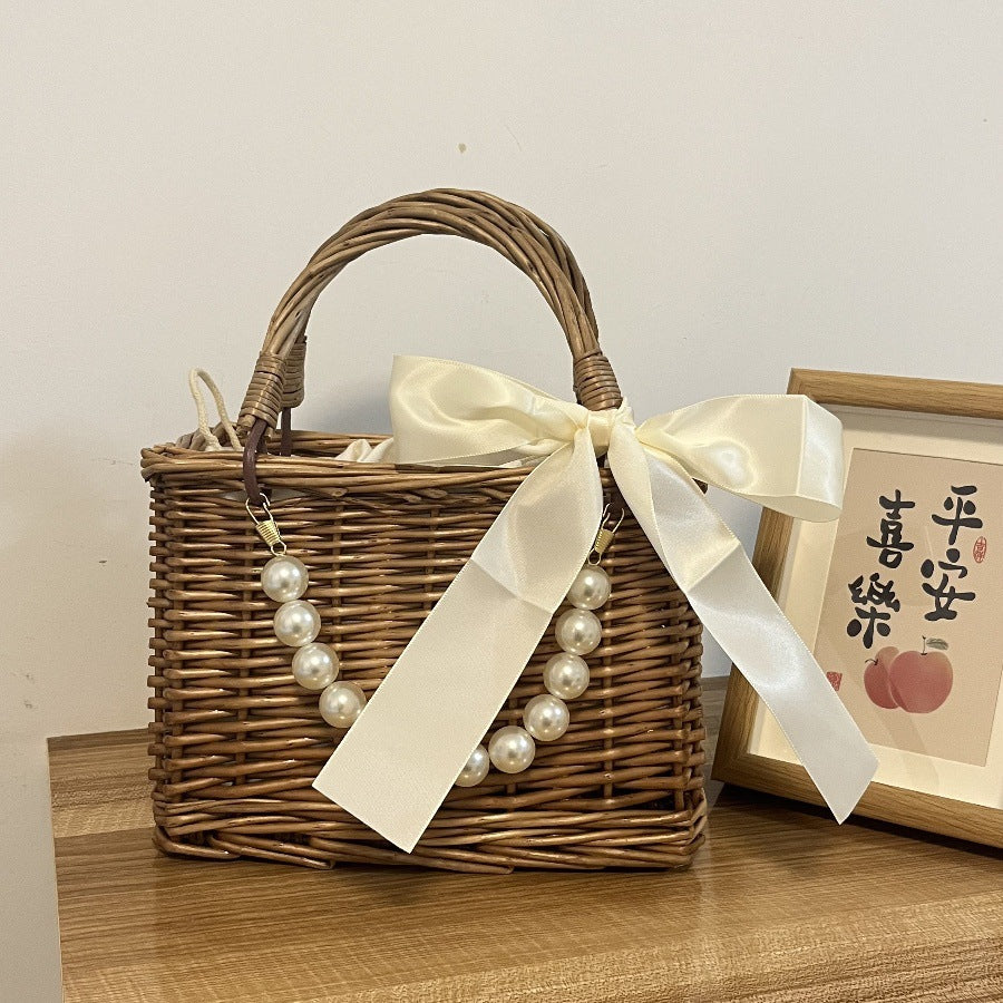 Ladies' basket bag with decorative pearl accents and bow decoration Bowlift