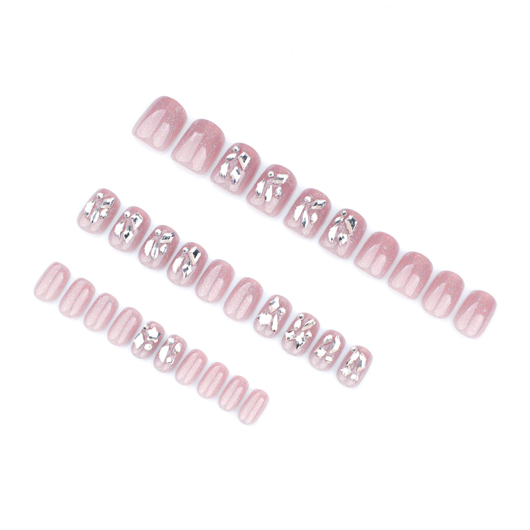 Artificial nail art with glamorous glitter accents Bowlift