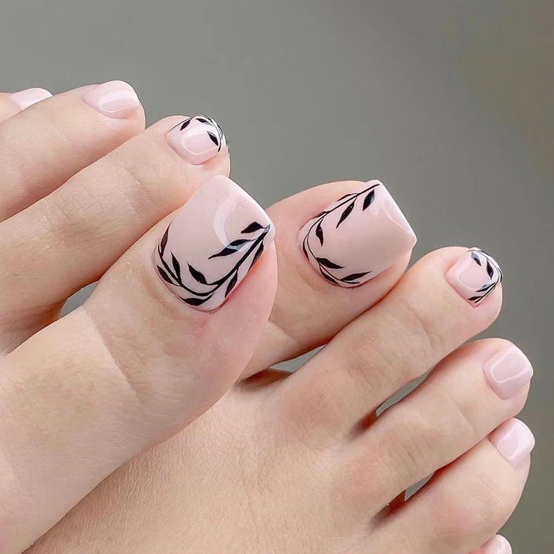 Artful toenail art with delicate leaf motifs Bowlift