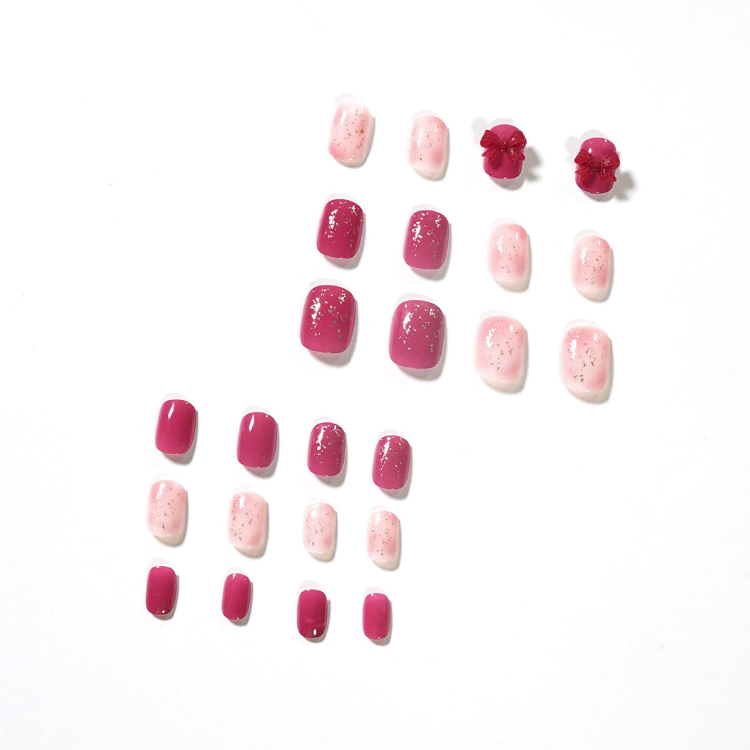 Artificial nail art with glitter embellishments and cute bow motif Bowlift