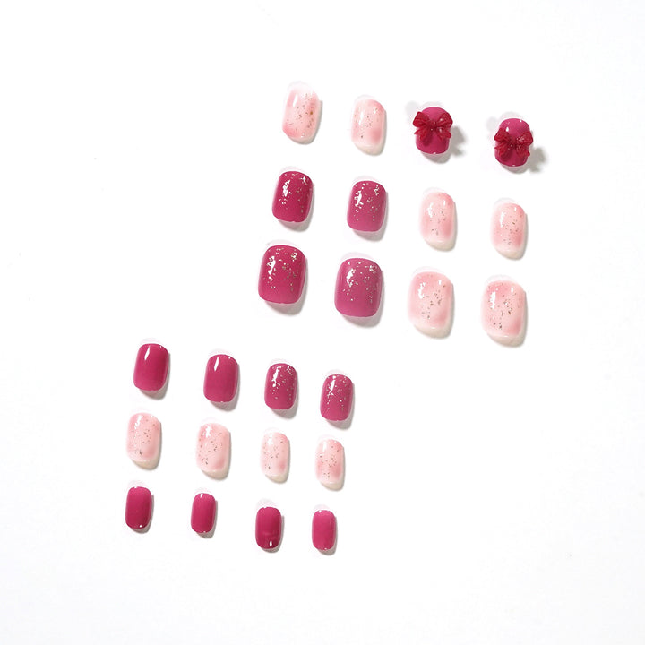 Artificial nail art with glitter embellishments and cute bow motif Bowlift