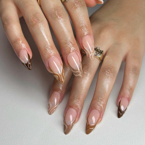 Artful stiletto nails with elegant gradient and glitter accents Bowlift