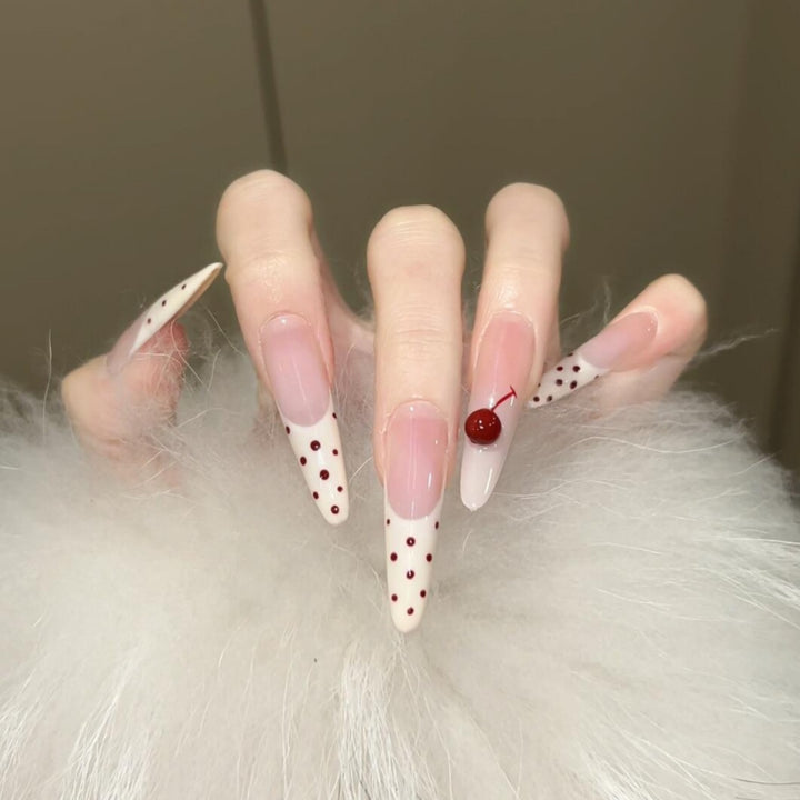 Artificial nails with playful design and cherry accents Bowlift