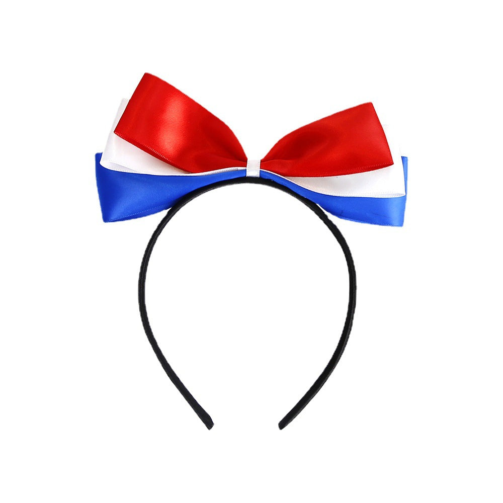 Ladies' festive hairband with pom poms, star embellishments, and glitter tinsel Bowlift