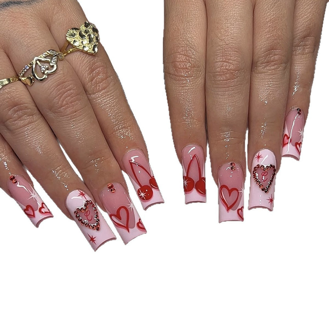 Artificial nail set with romantic heart designs and sparkling rhinestone decorations Bowlift