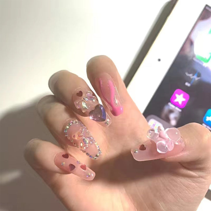 Artful Gel Nails with Elegant Floral Design and Glitter Accents Bowlift