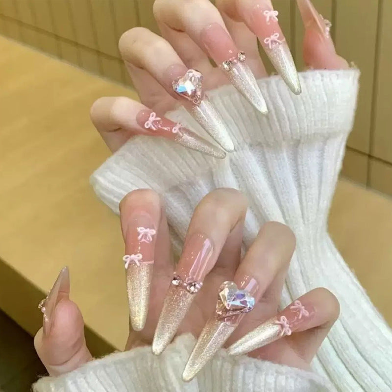 Art nail set with sparkling tips and delicate bow decorations Bowlift
