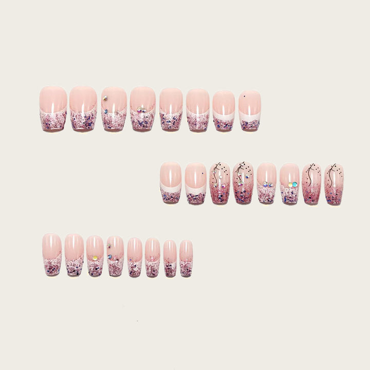 Glamorous artificial nails with glitter and rhinestone embellishments Bowlift