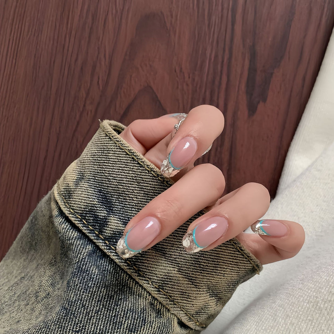 Artificial nails with shimmering glitter and elegant French-tip design Bowlift