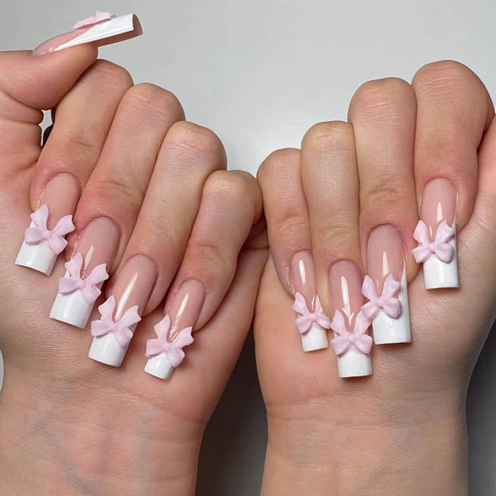 Artificial nails with playful bow design Bowlift