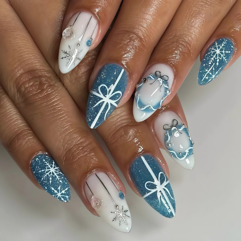 Artificial nails in elegant winter design with glitter accents Bowlift
