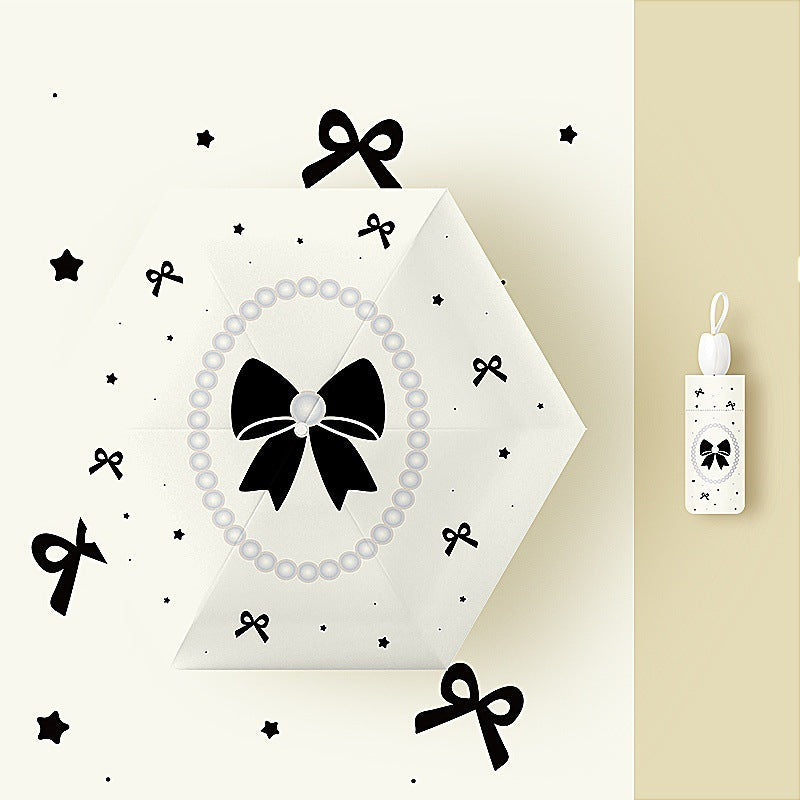 Ladies folding umbrella with playful flower design Bowlift