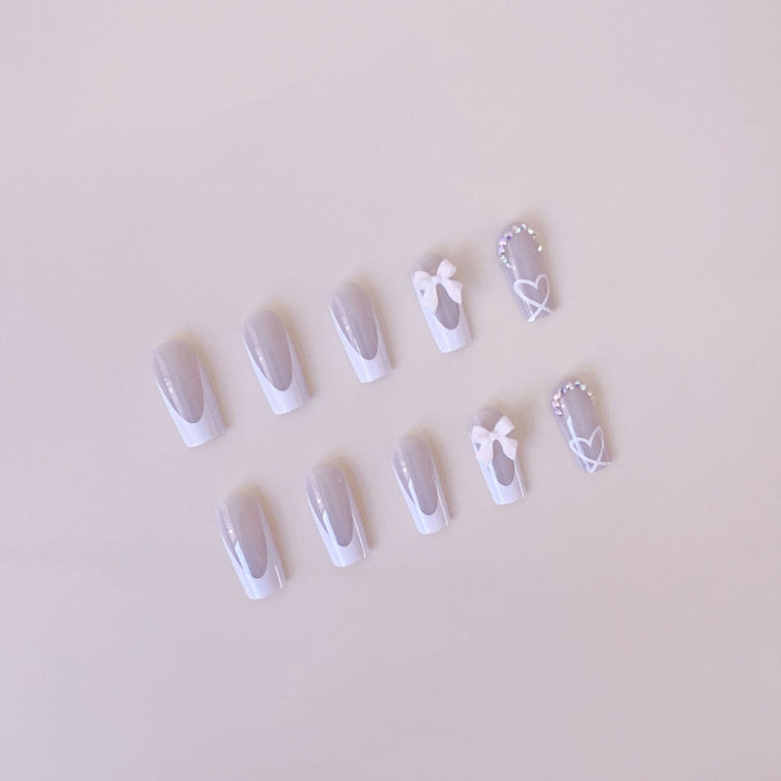 Artificial nail set with elegant bow and glitter decorations Bowlift