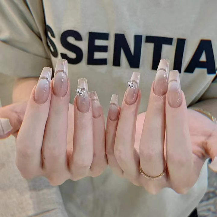 Glamorous artificial nails with elegant rhinestone decorations Bowlift