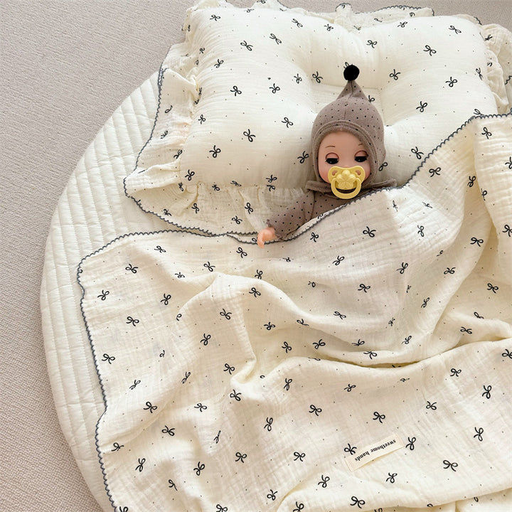 Unisex Muslin Blanket with delicate floral design and elegant ruffles Bowlift