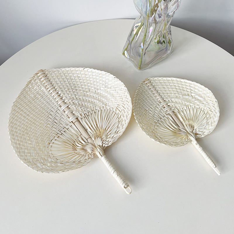 Women hand-woven fan made of natural material Bowlift