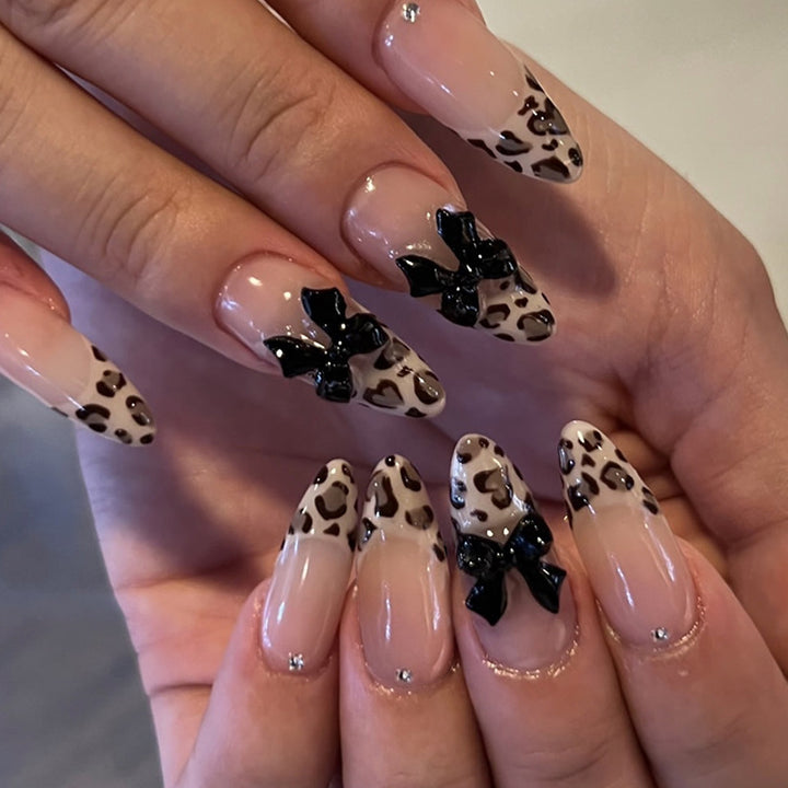 Artistic Press-On Nail Set with Leopard Print and Bow Accents Bowlift
