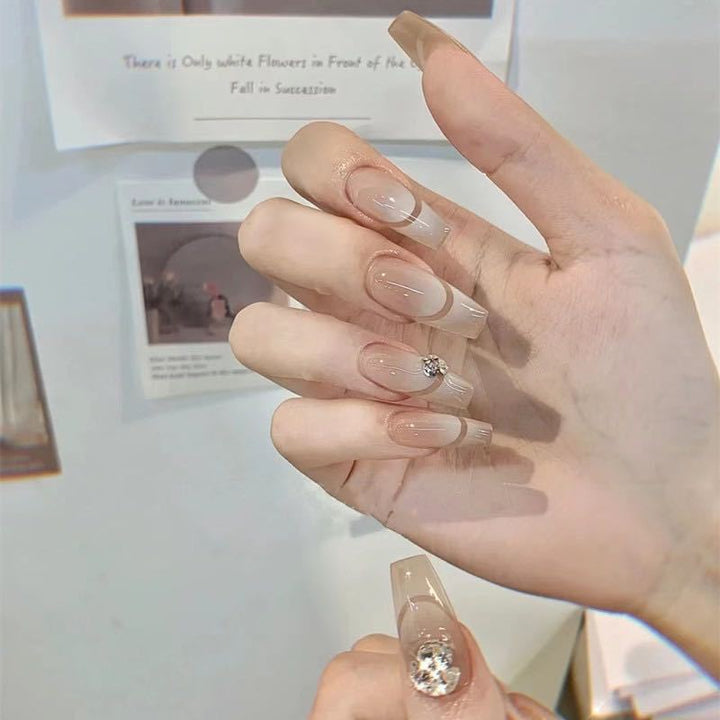 Glamorous artificial nails with elegant rhinestone decorations Bowlift