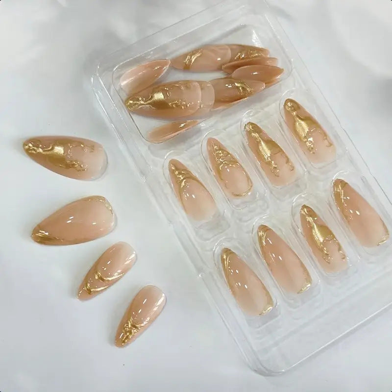 Elegant Stiletto Nail Enhancements with Gold Accent Details Bowlift