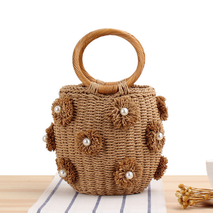 Handcrafted basket bag with bead appliqués Bowlift
