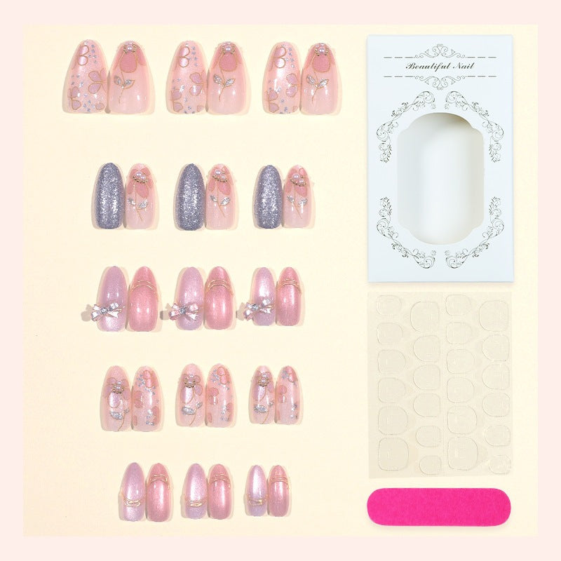 Artificial nail set with decorative flower and glitter embellishments Bowlift