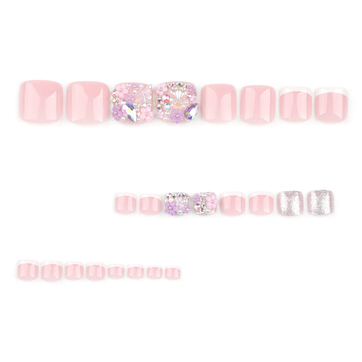 Artistic toenail art with floral accents and glitter Bowlift