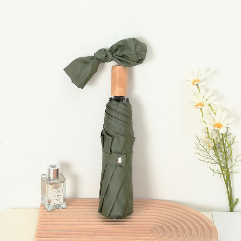 Ladies compact folding umbrella with elegant design and ergonomic wooden handle Bowlift