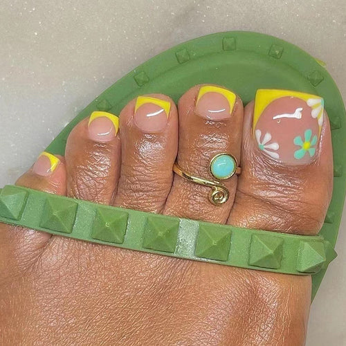 Creative toenail art with colorful flower accents Bowlift