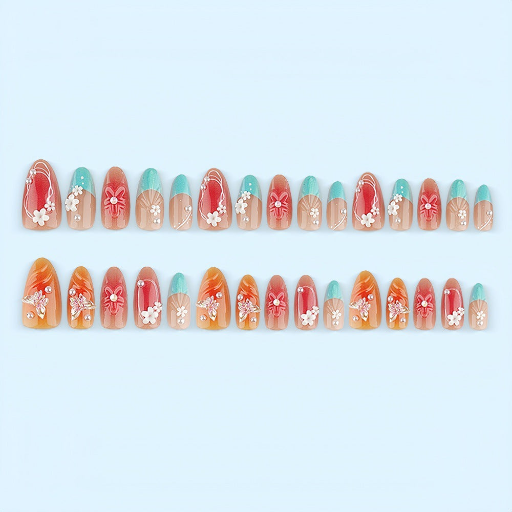 Artificial nail set with floral accents and glittering 3D applications Bowlift