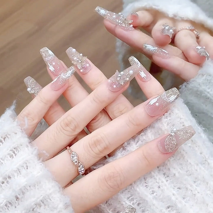 Glamorous artificial nails with heart-shaped accents Bowlift