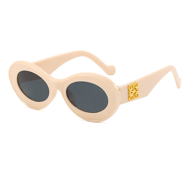 Women's fashionable sunglasses with oval frame and golden applications Bowlift